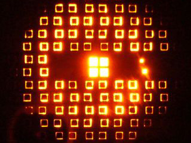 Silicon membrans shining through in a wafer holder with a built-in LED light source.